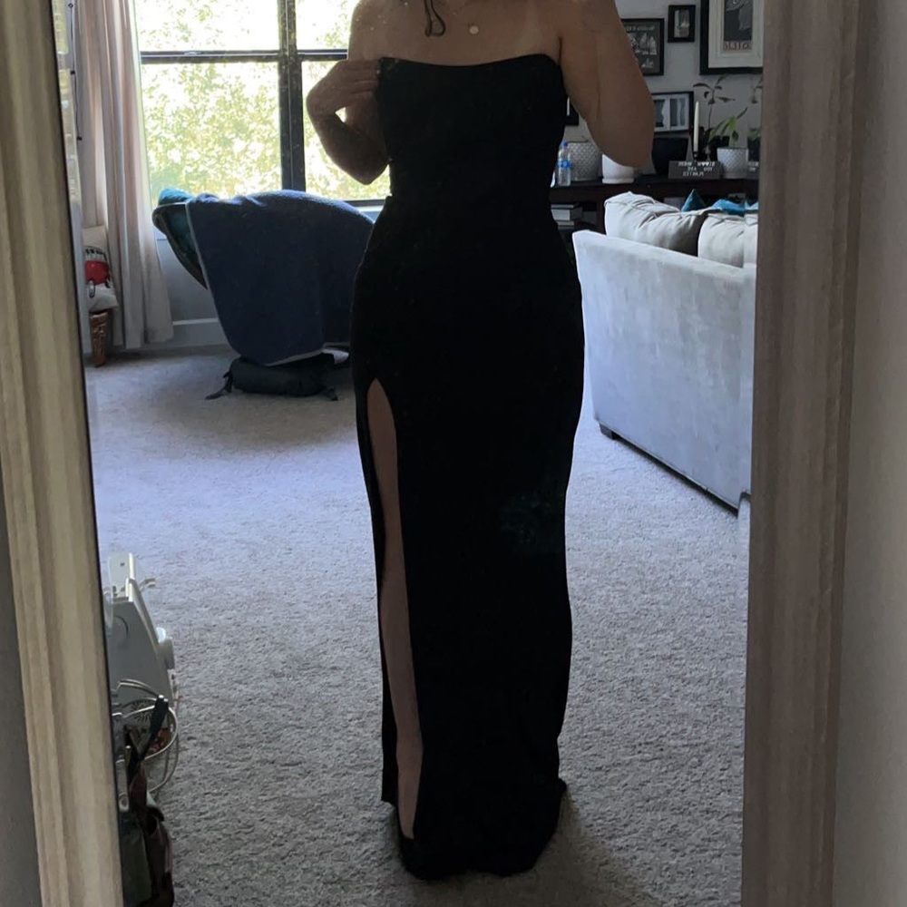 Black strapless dress left leg slit